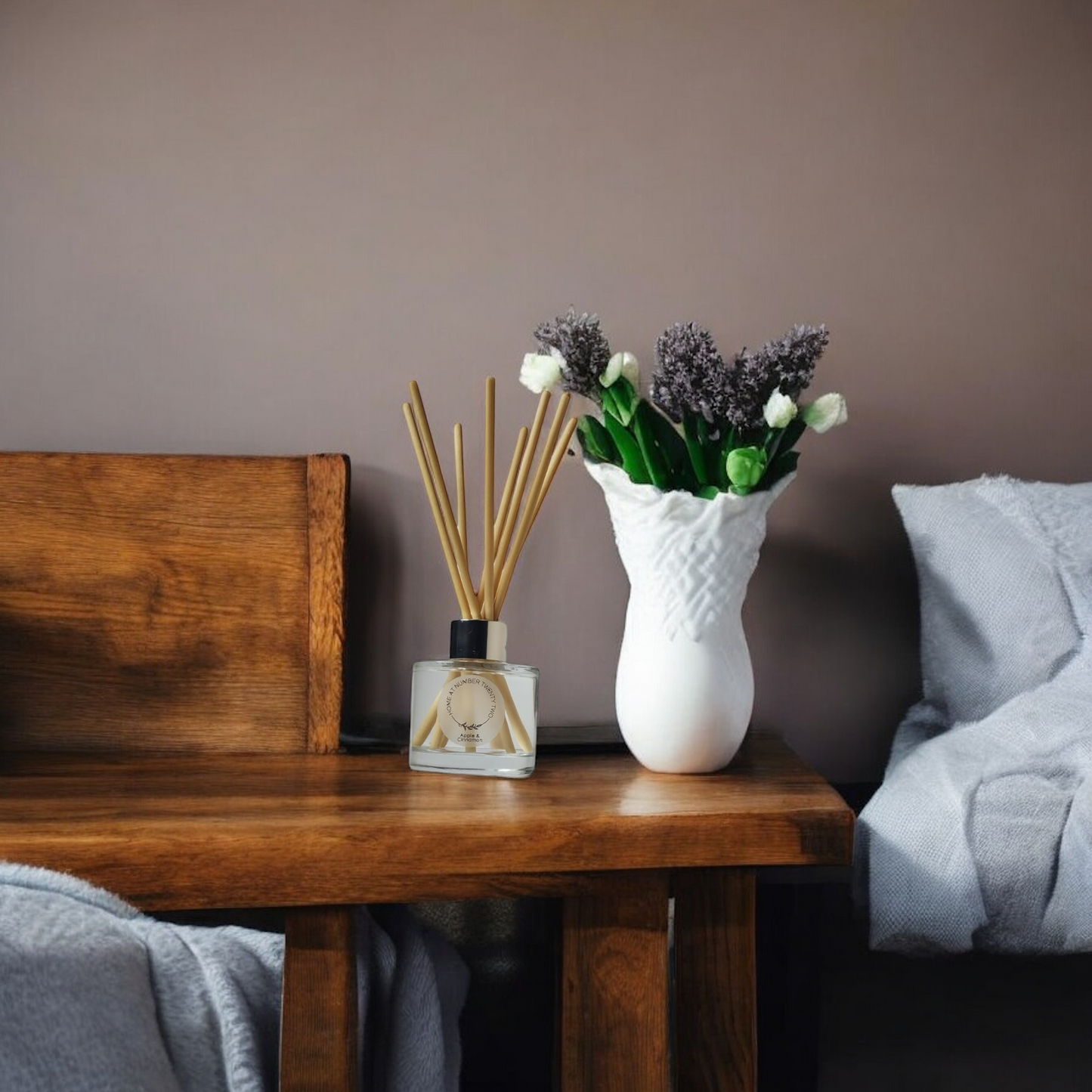 Apple and Cinnamon Reed Diffuser by Home at Number Twenty Two - a warm and inviting home fragrance with sweet apple and spicy cinnamon notes, elegantly presented with natural reeds.