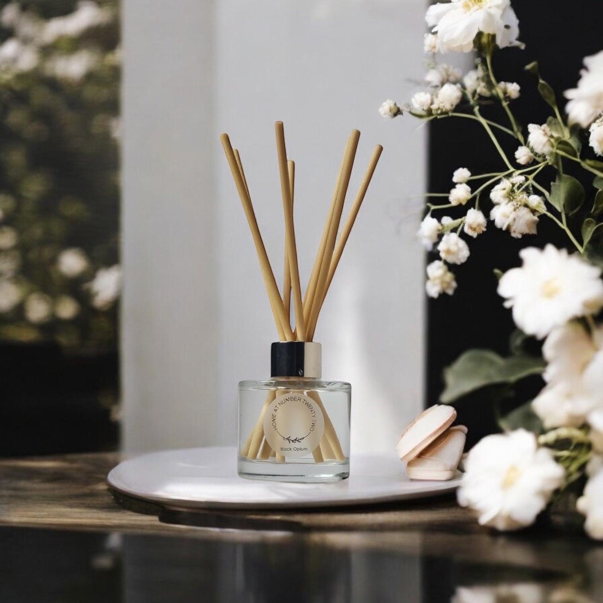 Black Opium Reed Diffuser by Home at Number Twenty Two – a luxurious and captivating home fragrance with rich coffee, vanilla, and, floral notes, elegantly presented with natural reeds.
