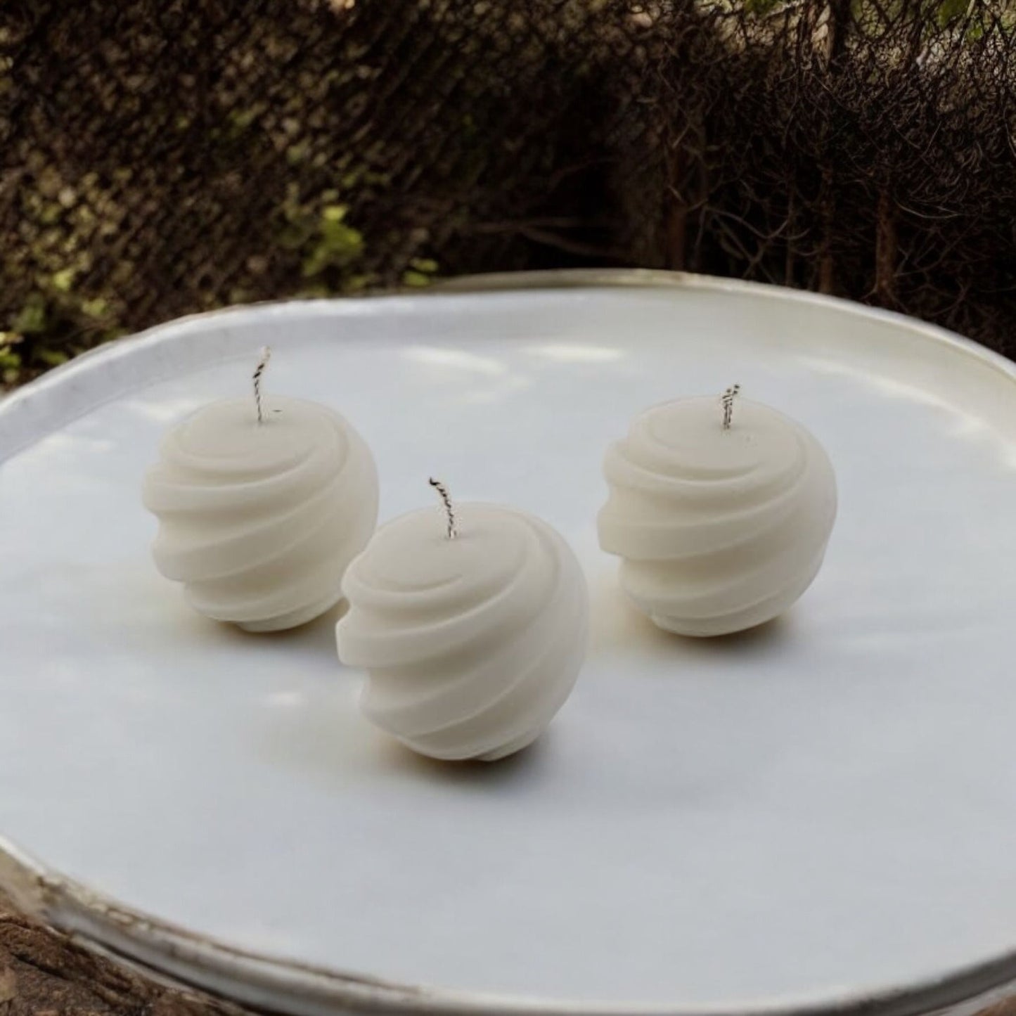 Twirl Orb Candles by Home at Number Twenty Two – elegantly handcrafted spherical candles with a delicate twirl design, perfect for adding a warm and decorative touch to any space.