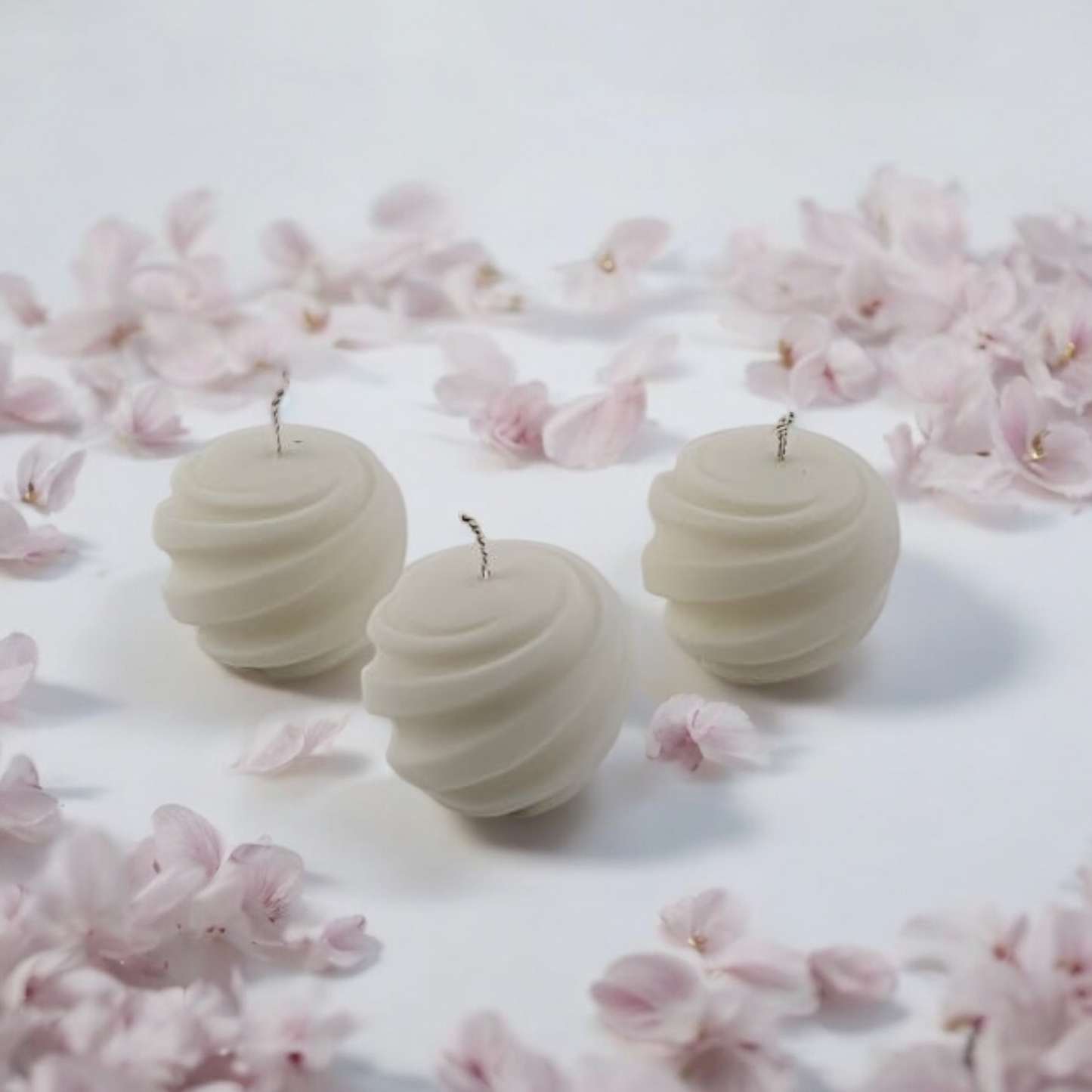 Twirl Orb Candles by Home at Number Twenty Two – elegantly handcrafted spherical candles with a delicate twirl design, perfect for adding a warm and decorative touch to any space.