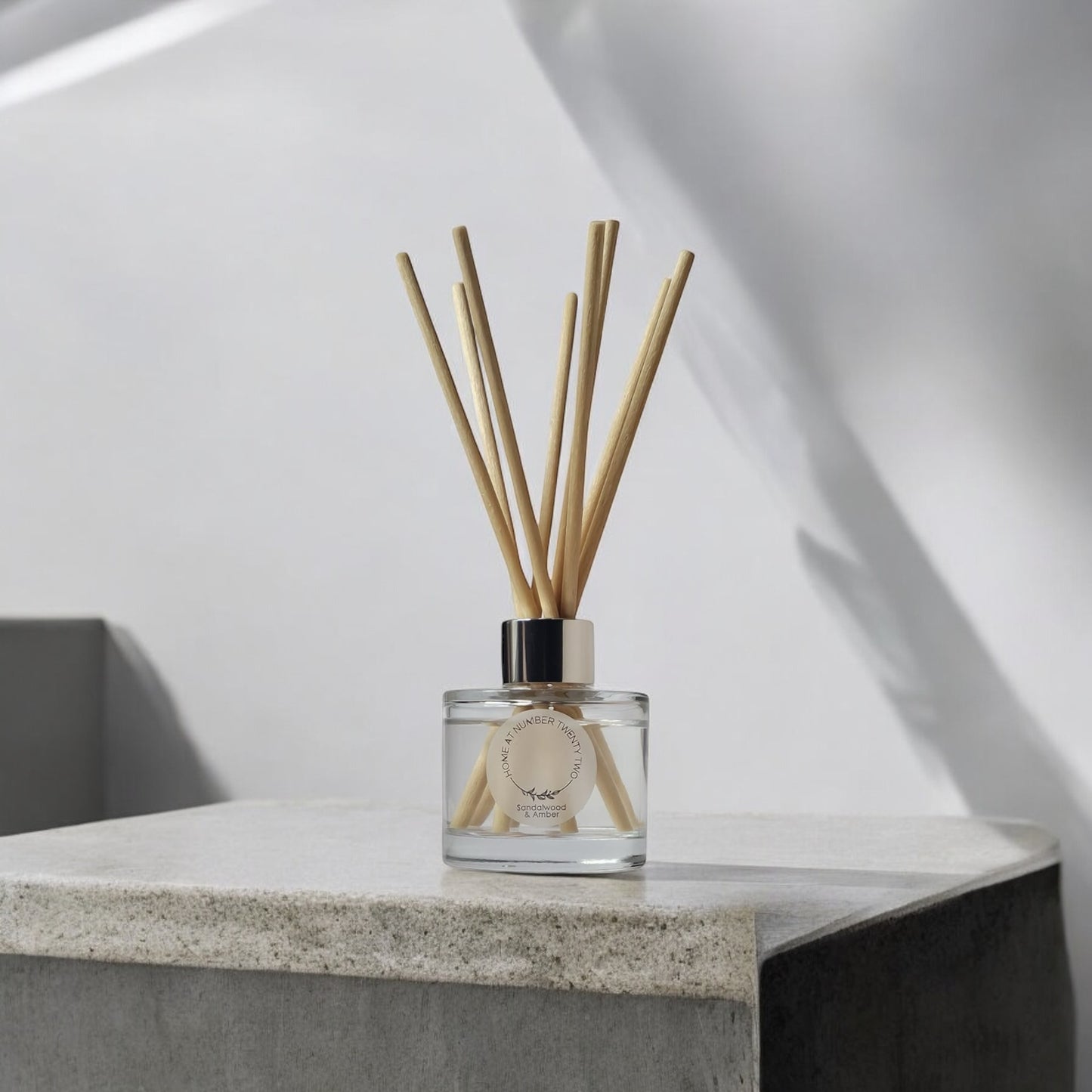 Sandalwood and Amber Reed Diffuser by Home at Number Twenty Two – a warm and luxurious home fragrance with rich sandalwood, golden amber, and subtle vanilla notes, elegantly presented with natural reeds.