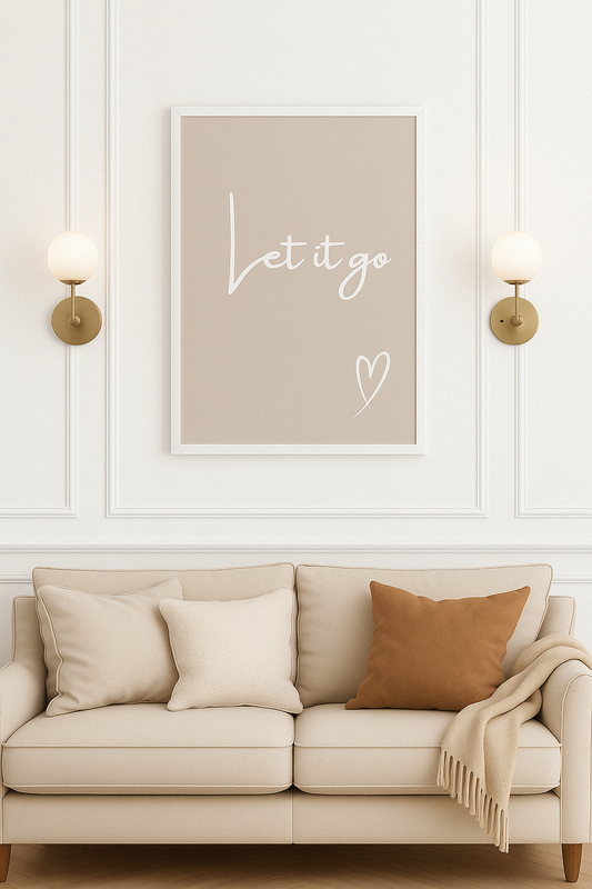 Let It Go Calm Typography Wall Art in Taupe, with white calligraphy style writing and white hand-drawn style heart, styled in a calm living room