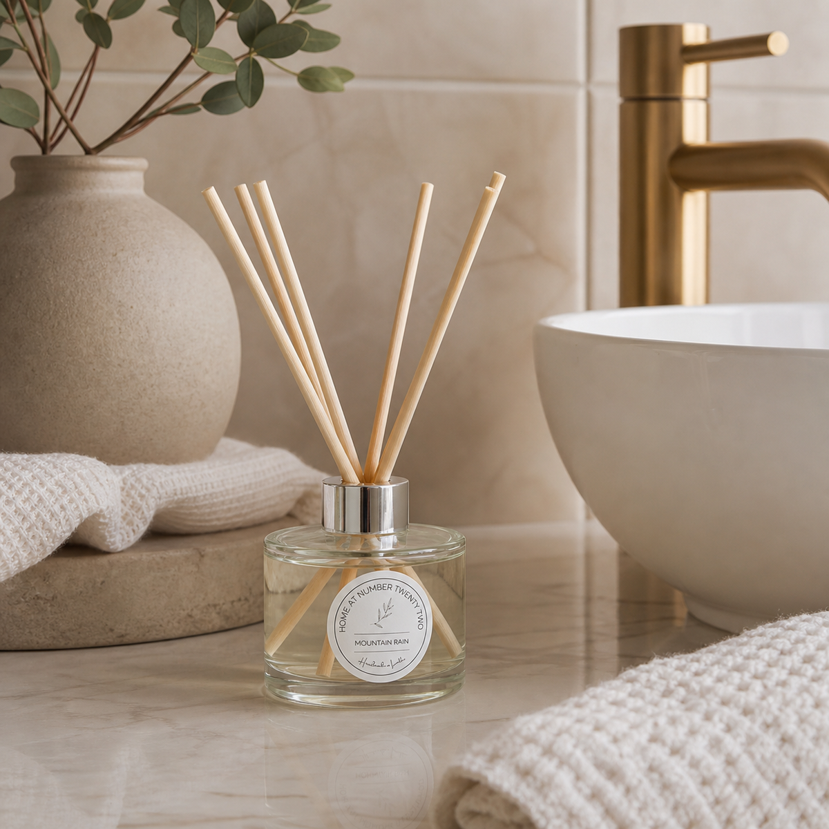Mountain Rain Reed Diffuser styled in a modern Scandi bathroom, creating a fresh spa-inspired home fragrance with clean, natural woodland notes.