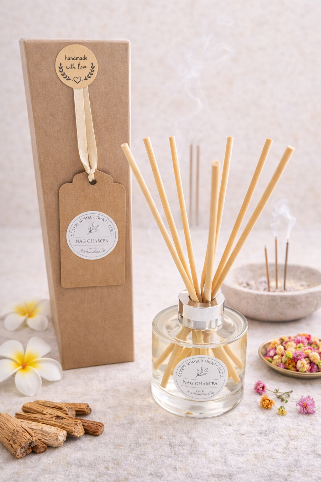 Nag Champa Reed Diffuser shown with incence, flowers and wood in background, alongside Home at Number Twenty Two branded kraft gift box