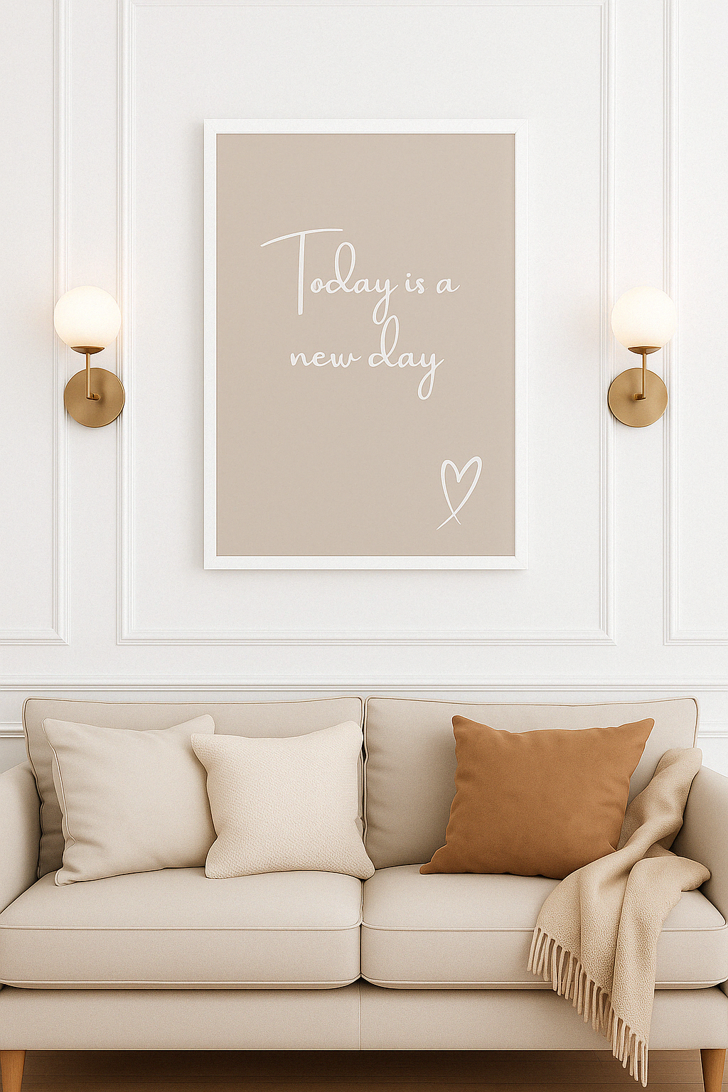 Beige sofa with pillows and a framed print saying ''today is a new day'' on a white wall