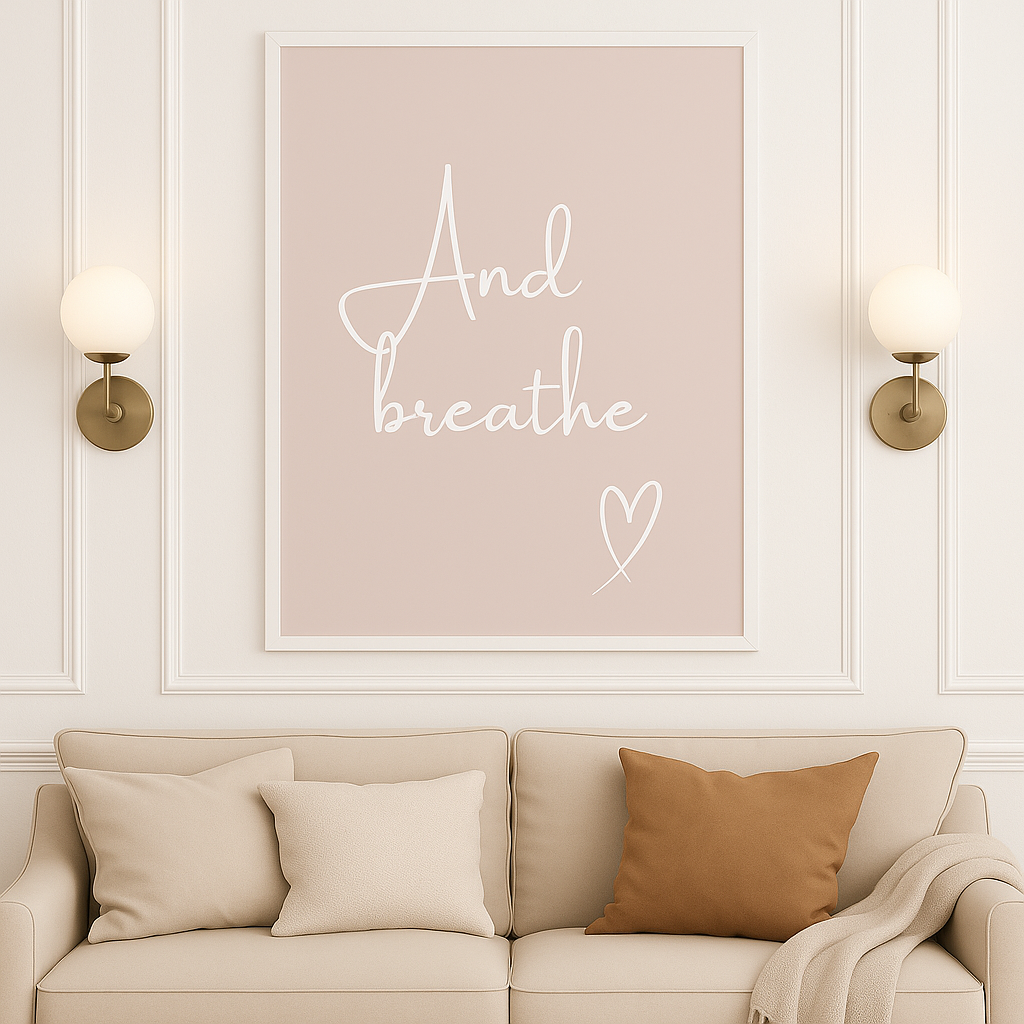 And Breathe Calm Wall Art with a taupe background and white calligraphy style font with hand-drawn style heart, set in a neutral, styled living room