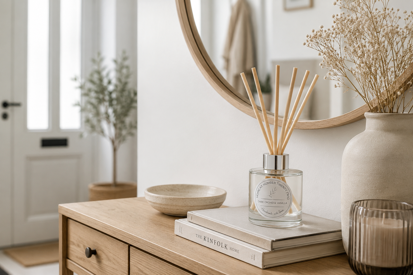 Handmade Dark Orchid & Vanilla Reed Diffuser styled on a console table beneath a mirror, bringing luxurious floral fragrance to your home.