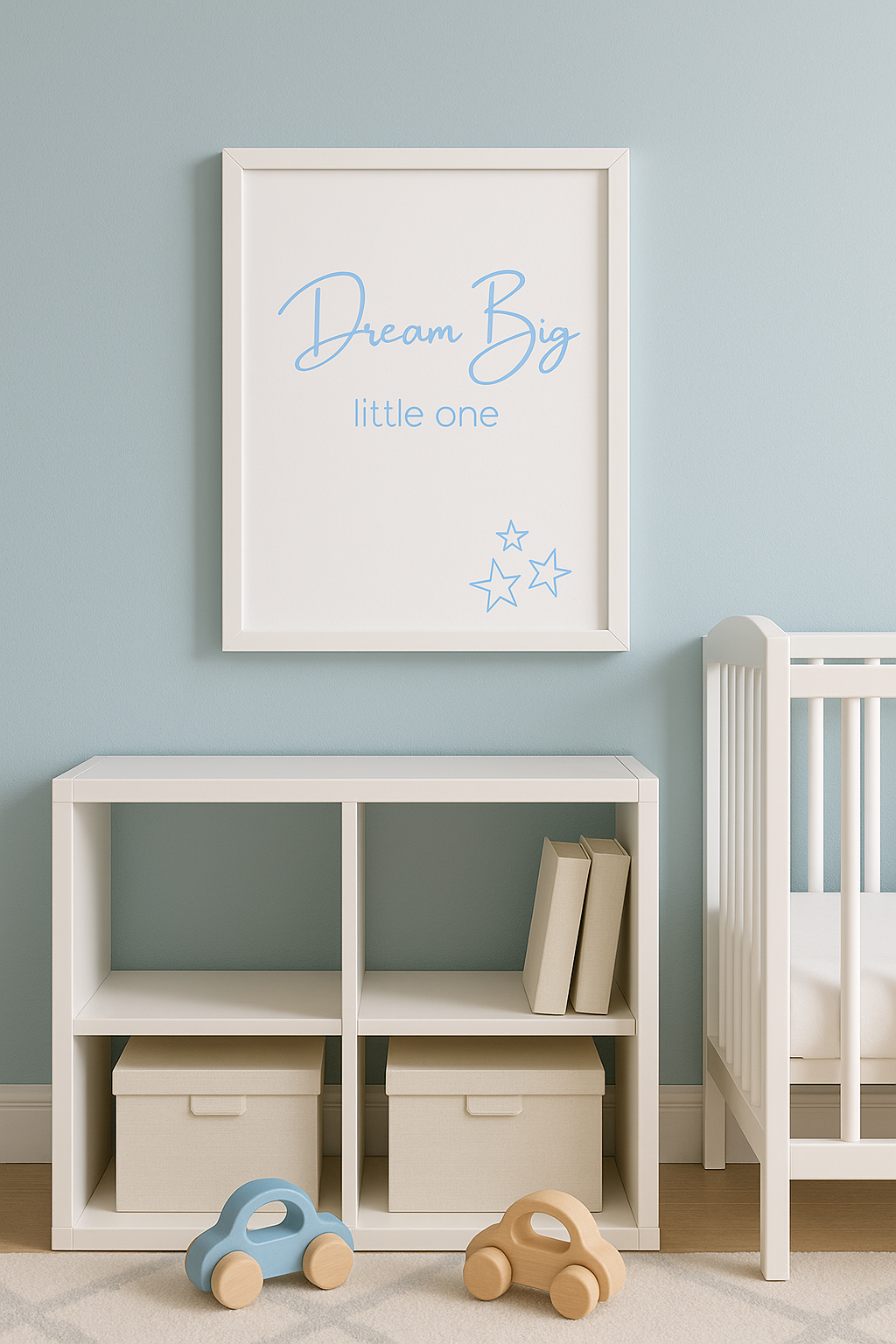 Dream Big Little One Pastel blue wall art above children's bookcase with wooden toy cars
