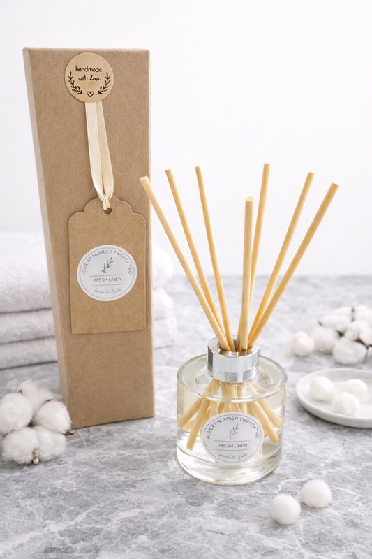 Fresh Linen Reed Diffuser on marble background with cotton and fresh white towels