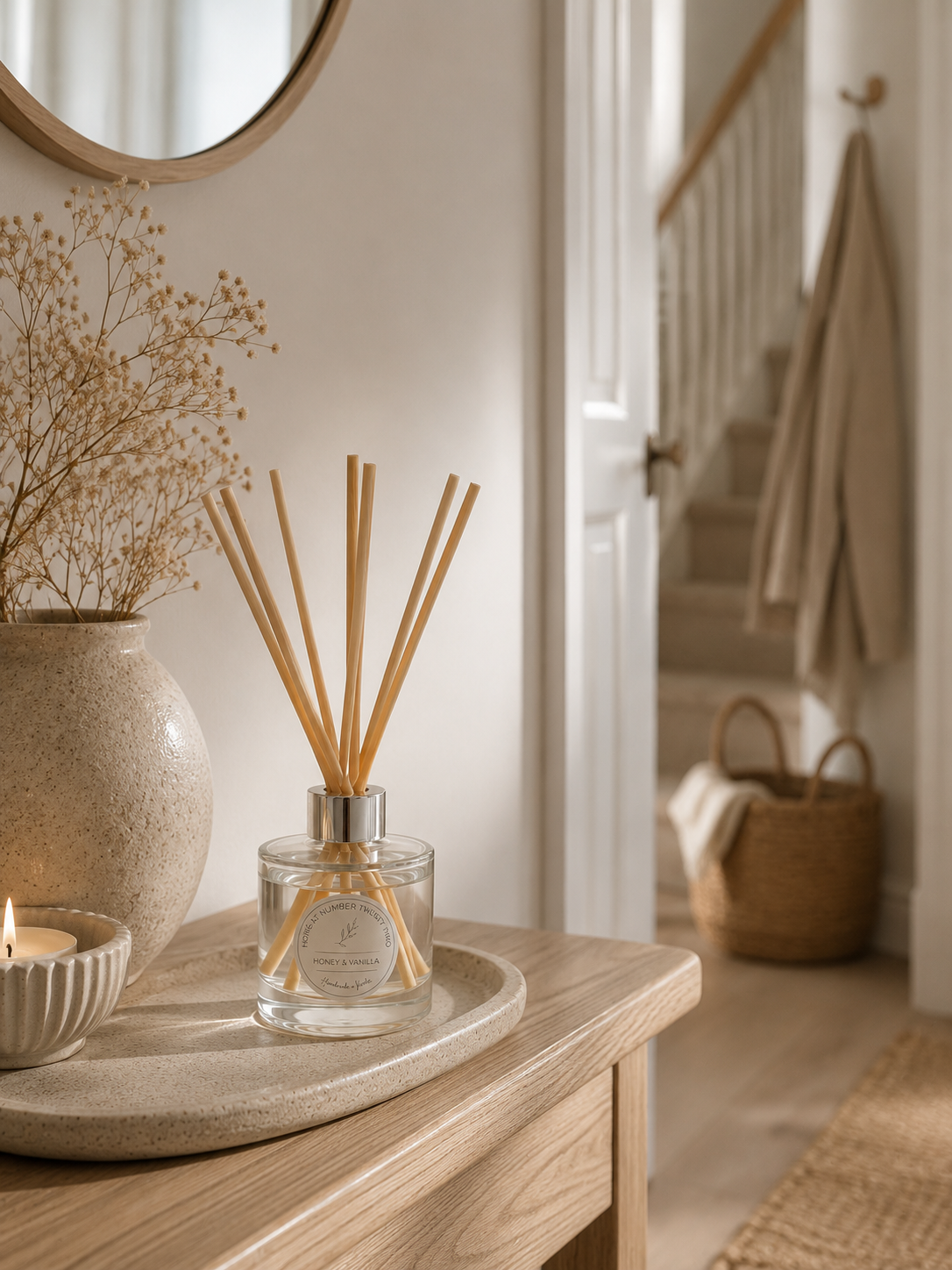 Handmade Honey & Vanilla Reed Diffuser styled on a hallway console with neutral décor, creating a cosy and inviting home.