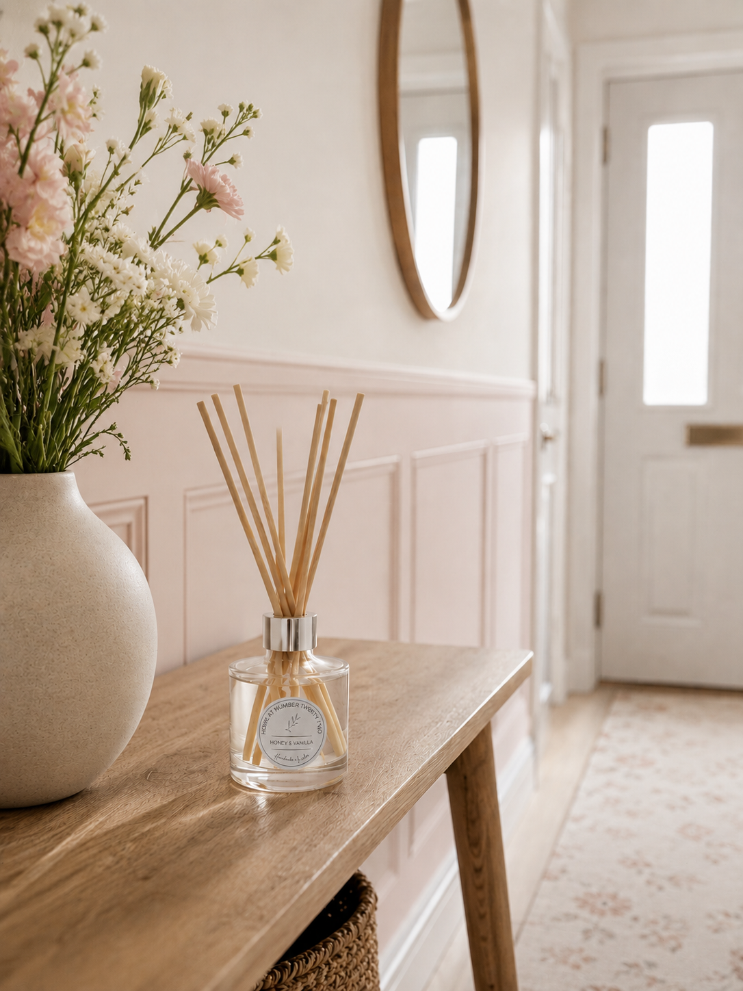 Luxury Honey & Vanilla Reed Diffuser on a Scandi hallway console table, bringing a warm welcome and elegant home fragrance.