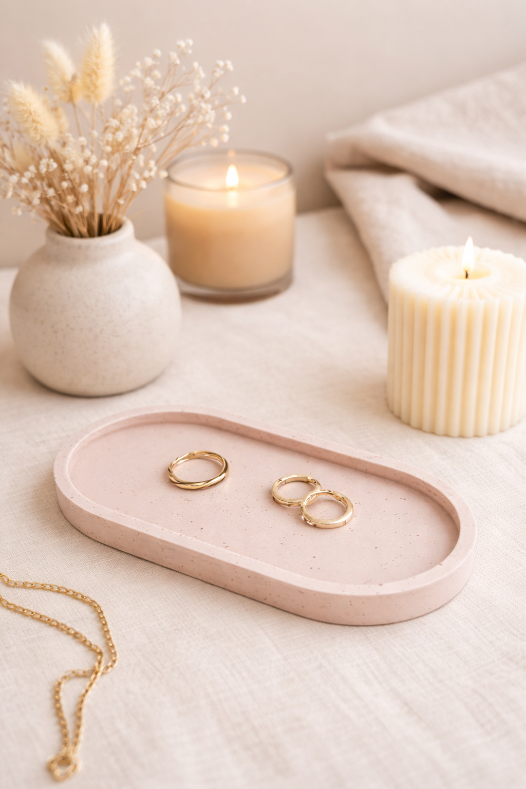 Pink Jesmonite Trinket Tray, styled with gold rings and linen background with candles and dried flowers