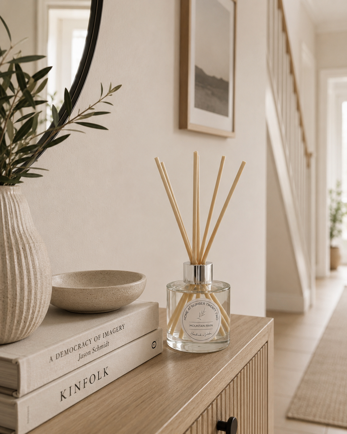 Mountain Rain Reed Diffuser displayed on a Scandi hallway console table, bringing fresh woodland fragrance to your home's entrance.