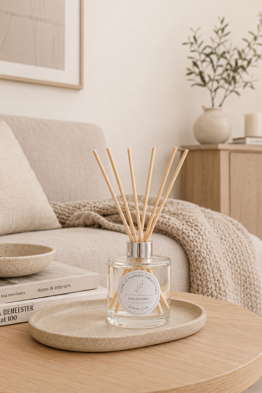 Nag Champa Reed Diffuser on a coffee table in a cosy living room, creating a relaxing atmosphere with warm sandalwood fragrance.