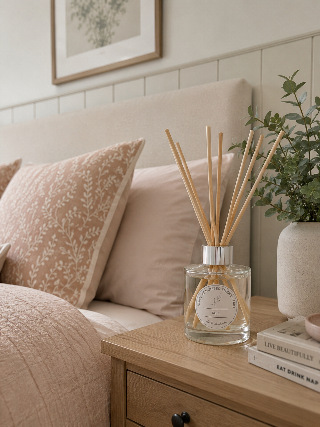 Rose Reed Diffuser displayed on a bedside table in a cosy bedroom, adding elegant floral fragrance to a modern home.