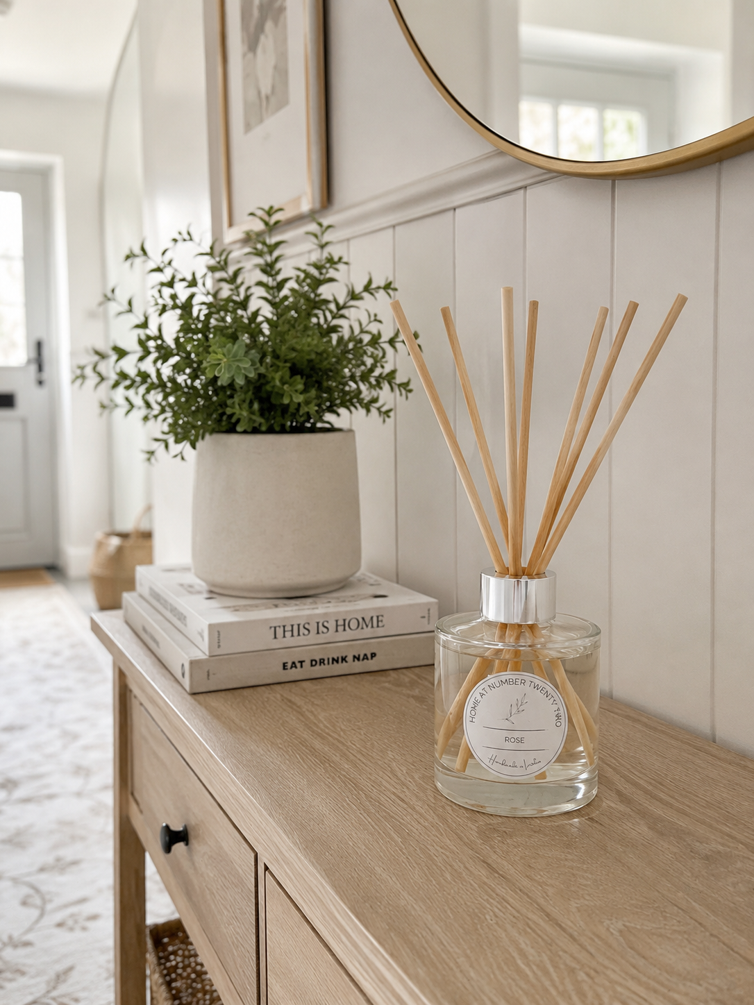 Handmade Rose Reed Diffuser on a hallway console table, bringing a fresh floral fragrance and timeless style to your home.