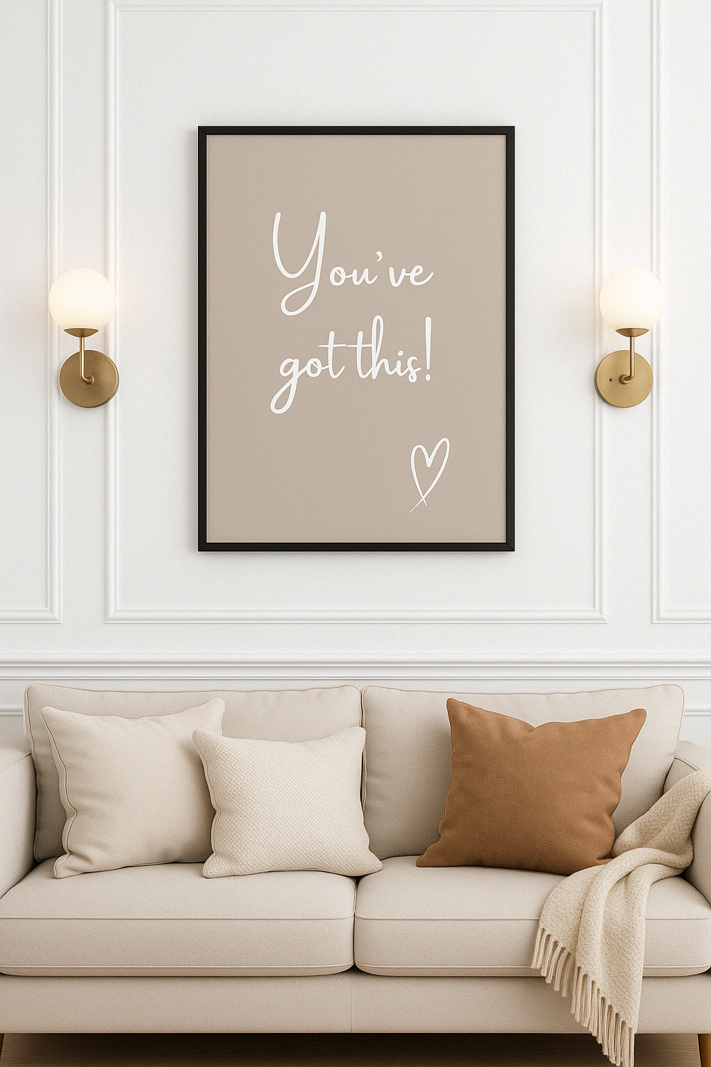 Framed poster with 'You've got this!' text on a wall above a beige sofa.